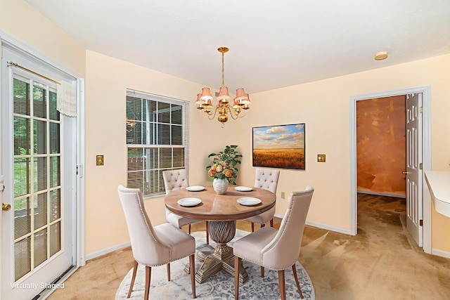 202 Langshire Ct, Florence, KY 41042 - dining space with a chandelier, baseboards, and light colored carpet