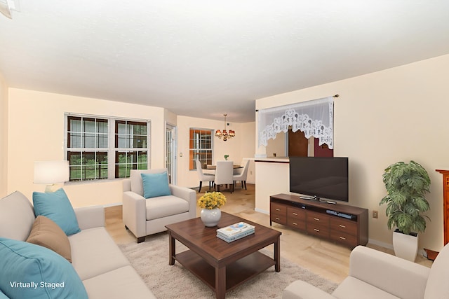 202 Langshire Ct, Florence, KY 41042 - living area featuring a chandelier and baseboards