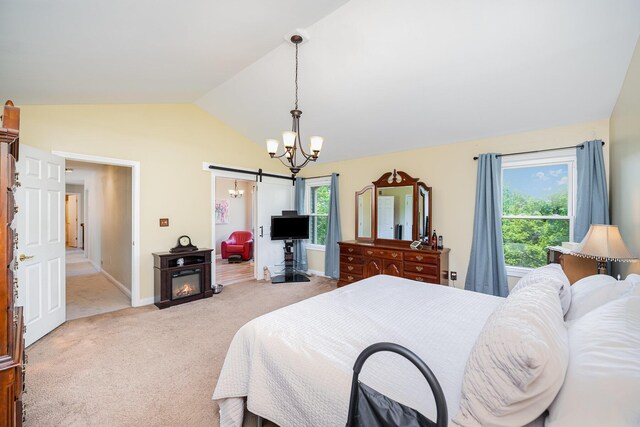 10659 Mountain Laurel Way, Union, KY 41091 - bedroom with lofted ceiling, a barn door, light colored carpet, a chandelier, and baseboards