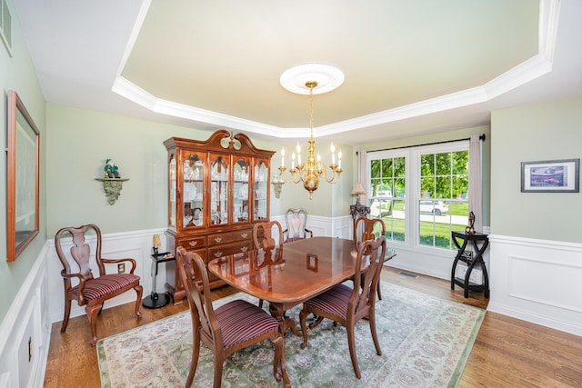 10659 Mountain Laurel Way, Union, KY 41091 - dining space with a raised ceiling, a chandelier, crown molding, a decorative wall, and a wainscoted wall
