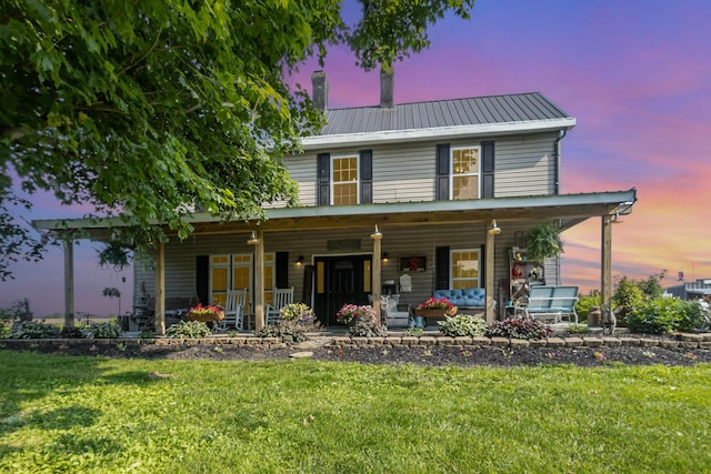 605 Lemon Northcutt Rd, Dry Ridge, KY 41035 - view of front of property featuring a porch, a front yard, a chimney, and metal roof