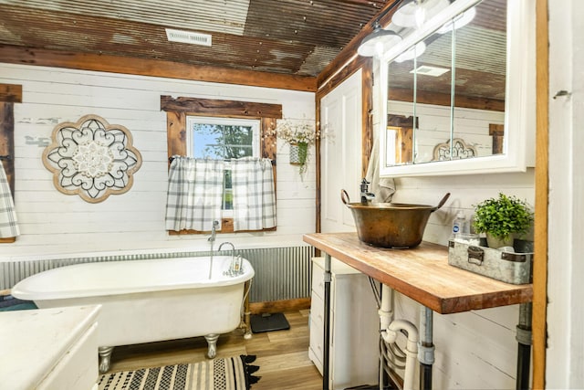 605 Lemon Northcutt Rd, Dry Ridge, KY 41035 - full bath with a soaking tub, wood finished floors, vanity, wood walls, and radiator heating unit