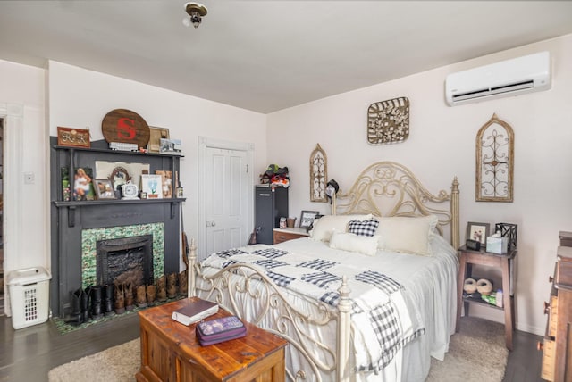 605 Lemon Northcutt Rd, Dry Ridge, KY 41035 - bedroom featuring an AC wall unit, wood finished floors, and a fireplace