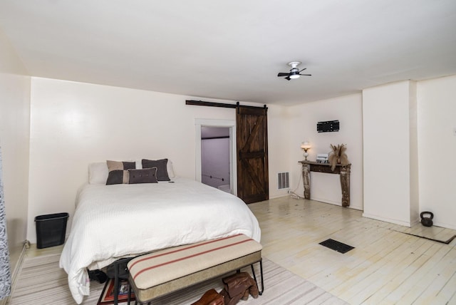 605 Lemon Northcutt Rd, Dry Ridge, KY 41035 - bedroom with a barn door and light wood finished floors