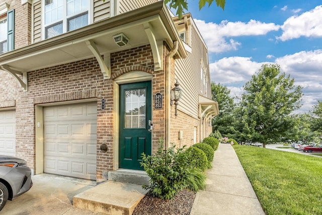 857 Slate Vw, Cold Spring, KY 41076 - property entrance featuring brick siding, a garage, and a yard