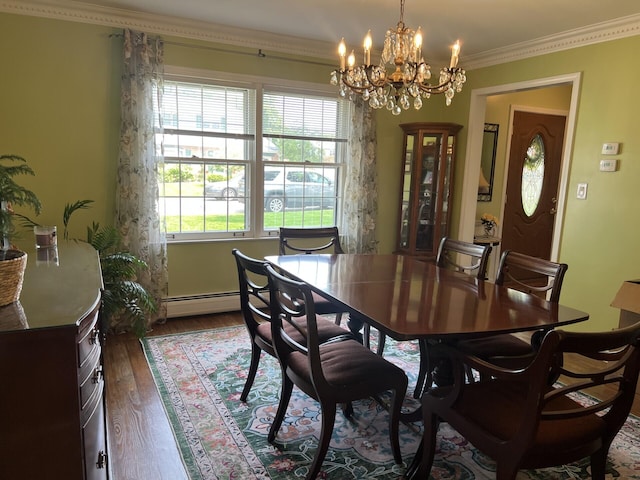 11 Alanna Dr, Wilder, KY 41076 - dining area with a chandelier, dark wood finished floors, ornamental molding, and baseboard heating