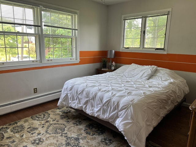 11 Alanna Dr, Wilder, KY 41076 - bedroom featuring multiple windows, wood finished floors, and baseboard heating