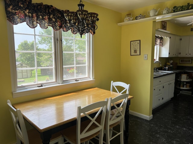 11 Alanna Dr, Wilder, KY 41076 - dining area featuring a chandelier, healthy amount of natural light, and baseboards