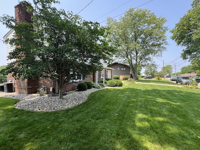 11 Alanna Dr, Wilder, KY 41076 - view of grassy yard featuring central AC unit