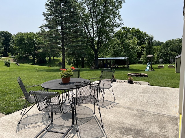 11 Alanna Dr, Wilder, KY 41076 - view of patio / terrace featuring an outdoor fire pit, outdoor dining area, and view of scattered trees