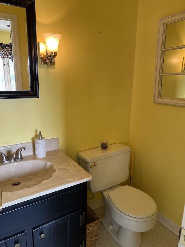 11 Alanna Dr, Wilder, KY 41076 - bathroom featuring toilet, vanity, tile patterned floors, and baseboards