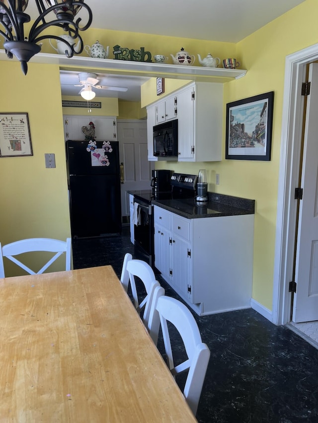 11 Alanna Dr, Wilder, KY 41076 - kitchen with black appliances, white cabinets, ceiling fan, dark countertops, and baseboards