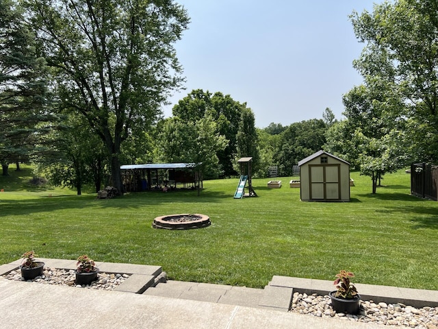 11 Alanna Dr, Wilder, KY 41076 - view of green lawn with an outdoor fire pit