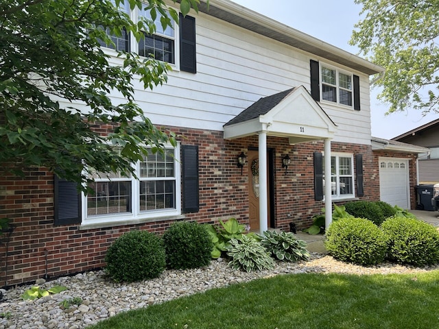 11 Alanna Dr, Wilder, KY 41076 - view of front of property featuring an attached garage and brick siding