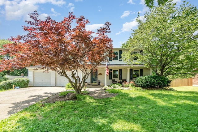 2919 Watts Rd, Burlington, KY 41005 - obstructed view of property featuring driveway, a garage, and covered porch