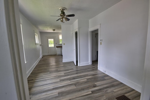 1823 Euclid Ave, Covington, KY 41014 - spare room featuring ceiling fan, dark wood-style floors, and baseboards