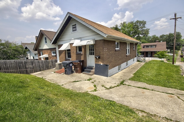 1823 Euclid Ave, Covington, KY 41014 - rear view of property featuring brick siding, entry steps, and cooling unit