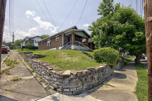1823 Euclid Ave, Covington, KY 41014 - view of home's exterior with brick siding and a lawn