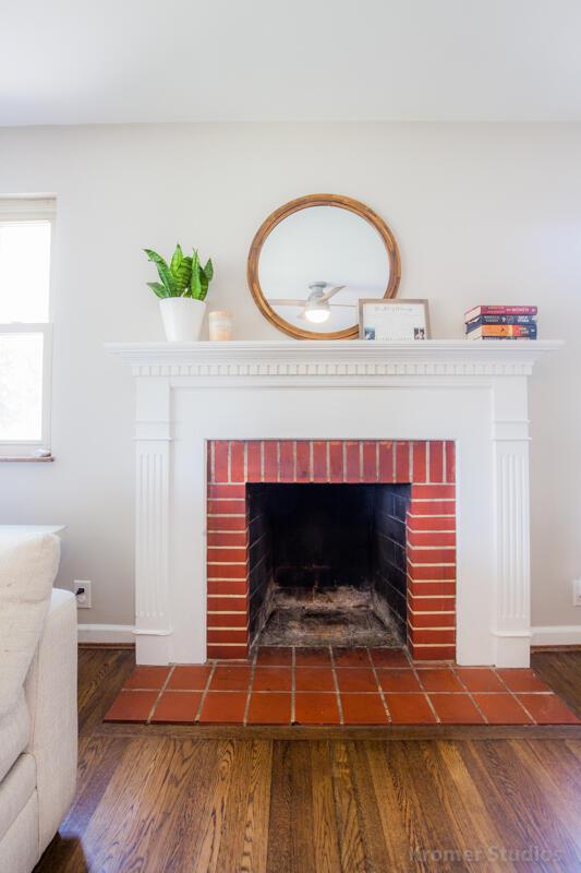 212 James Ave, Erlanger, KY 41018 - detailed view of a brick fireplace, wood finished floors, and baseboards