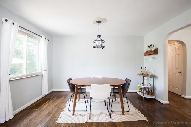 212 James Ave, Erlanger, KY 41018 - dining area with arched walkways, wood finished floors, and baseboards