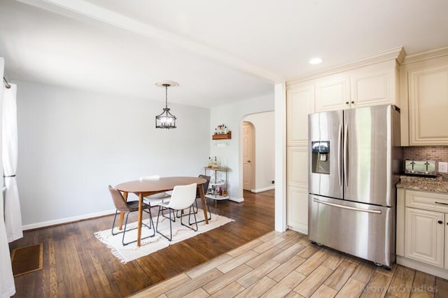 212 James Ave, Erlanger, KY 41018 - dining area featuring arched walkways, baseboards, light wood-style floors, and recessed lighting
