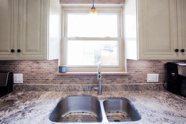 212 James Ave, Erlanger, KY 41018 - kitchen featuring a sink, cream cabinetry, tasteful backsplash, and light stone countertops