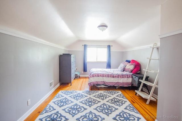 212 James Ave, Erlanger, KY 41018 - bedroom with lofted ceiling, wood finished floors, and baseboards