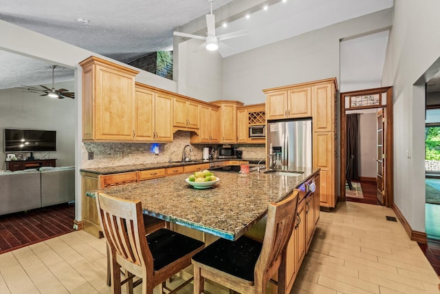 2709 Longbranch Rd, Union, KY 41091 - kitchen featuring a ceiling fan, stainless steel appliances, high vaulted ceiling, backsplash, and a sink