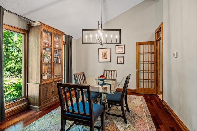 2709 Longbranch Rd, Union, KY 41091 - dining room featuring dark wood finished floors, a chandelier, lofted ceiling, and baseboards