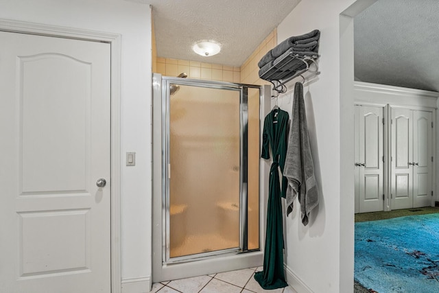 2709 Longbranch Rd, Union, KY 41091 - bathroom featuring a textured ceiling, a stall shower, tile patterned floors, and baseboards
