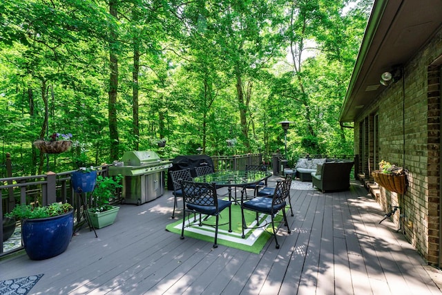 2709 Longbranch Rd, Union, KY 41091 - wooden terrace featuring a grill, an outdoor living space, outdoor dining space, and a view of trees