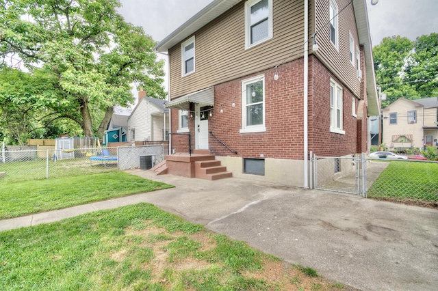 412 4th Ave, Dayton, KY 41074 - view of front of house featuring brick siding, a gate, and cooling unit