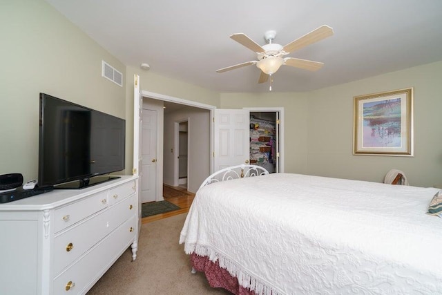 350 Leon Blvd, Williamstown, KY 41097 - bedroom featuring light colored carpet, a ceiling fan, and a walk in closet