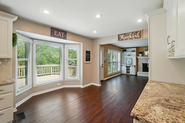 856 Moonstone Ct, Crescent Springs, KY 41017 - unfurnished living room featuring dark wood finished floors, a fireplace, baseboards, and recessed lighting