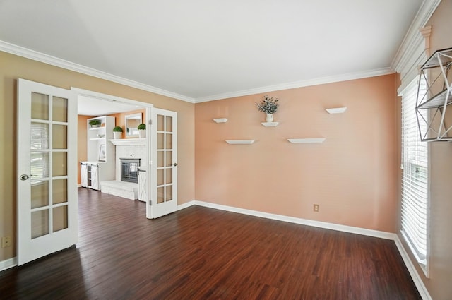 856 Moonstone Ct, Crescent Springs, KY 41017 - empty room with french doors, dark wood-style flooring, baseboards, ornamental molding, and a brick fireplace