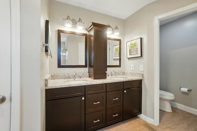 856 Moonstone Ct, Crescent Springs, KY 41017 - full bathroom featuring double vanity, toilet, and baseboards