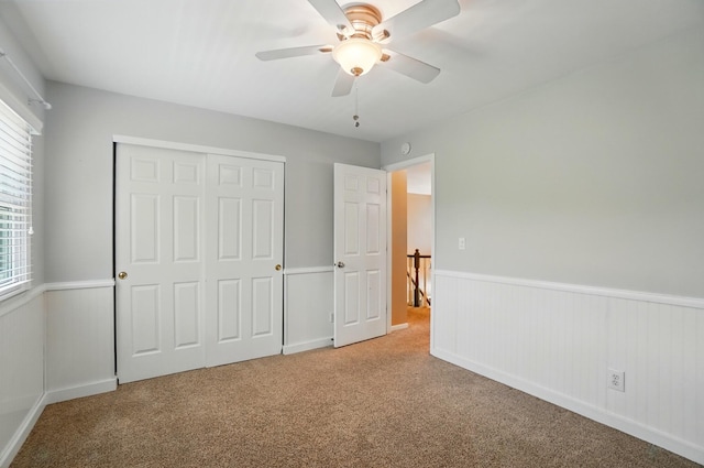 856 Moonstone Ct, Crescent Springs, KY 41017 - unfurnished bedroom featuring carpet floors, a wainscoted wall, a closet, and ceiling fan