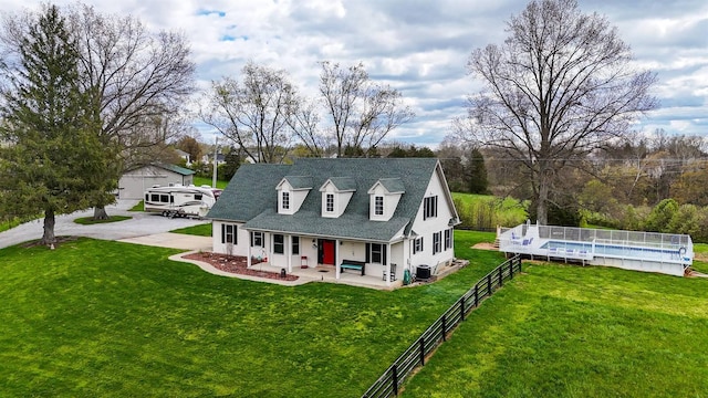 8949 E Main St, Alexandria, KY 41001 - cape cod-style house featuring a porch, an outdoor pool, and roof with shingles