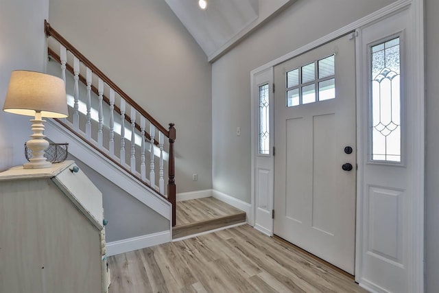 8949 E Main St, Alexandria, KY 41001 - entrance foyer featuring wood finished floors, baseboards, stairs, and high vaulted ceiling
