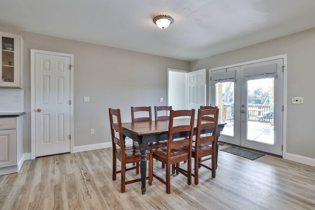 8949 E Main St, Alexandria, KY 41001 - dining area with light wood-type flooring, french doors, and baseboards