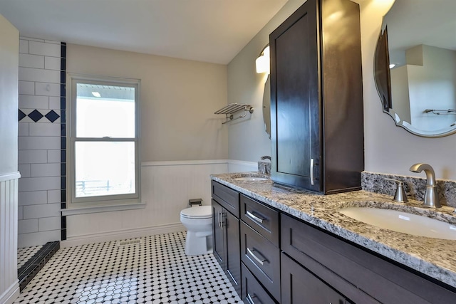 8949 E Main St, Alexandria, KY 41001 - full bath with a wainscoted wall, double vanity, toilet, and tiled shower