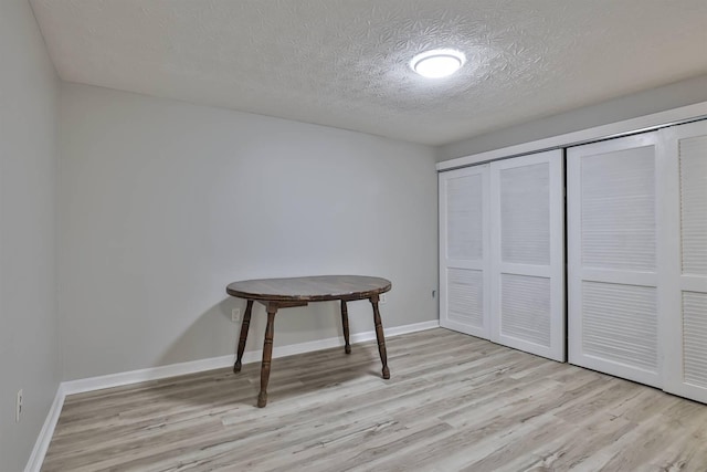 8949 E Main St, Alexandria, KY 41001 - unfurnished bedroom featuring wood finished floors, a textured ceiling, a closet, and baseboards