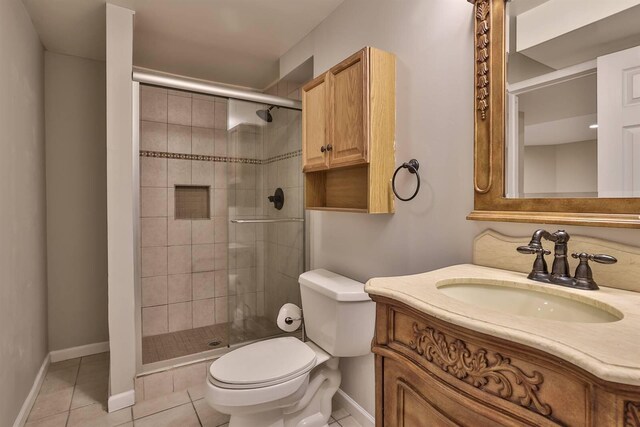 8949 E Main St, Alexandria, KY 41001 - bathroom featuring toilet, tile patterned floors, vanity, a stall shower, and baseboards