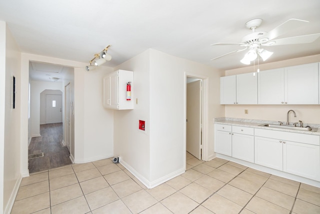 127 5th Ave, Dayton, KY 41074 - kitchen featuring a sink, light countertops, a ceiling fan, and baseboards