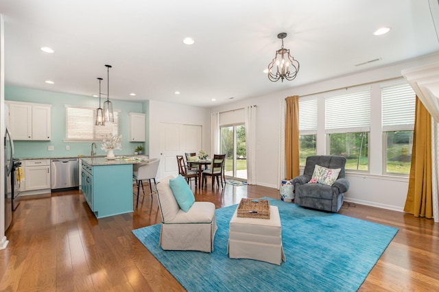 9733 Cobalt Way, Union, KY 41091 - living room with a chandelier, dark wood finished floors, recessed lighting, and baseboards
