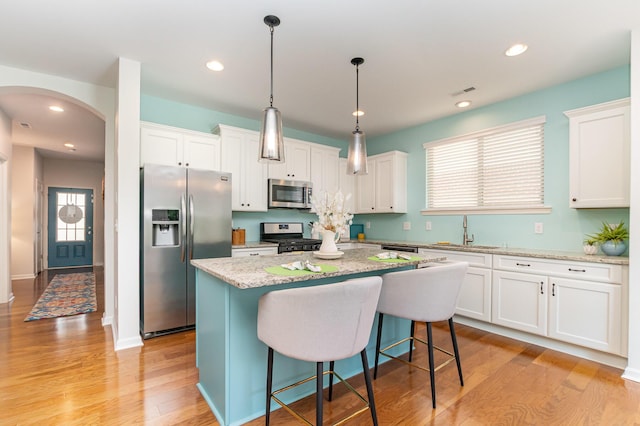 9733 Cobalt Way, Union, KY 41091 - kitchen featuring appliances with stainless steel finishes, a sink, white cabinetry, light wood-type flooring, and recessed lighting