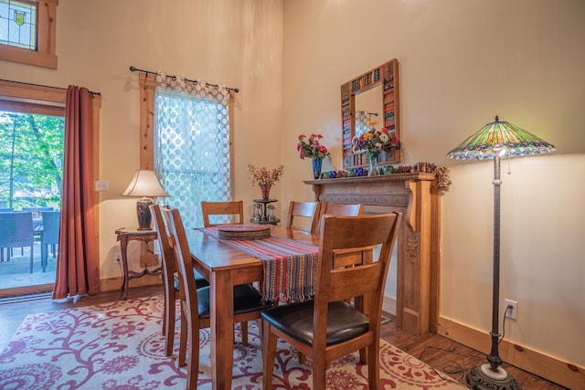 1145 Hillandale Dr, Sanders, KY 41083 - dining area featuring wood finished floors, baseboards, and a high ceiling