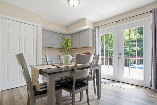 6161 Ridgewood Ct, Florence, KY 41042 - dining space with french doors and light wood-style flooring