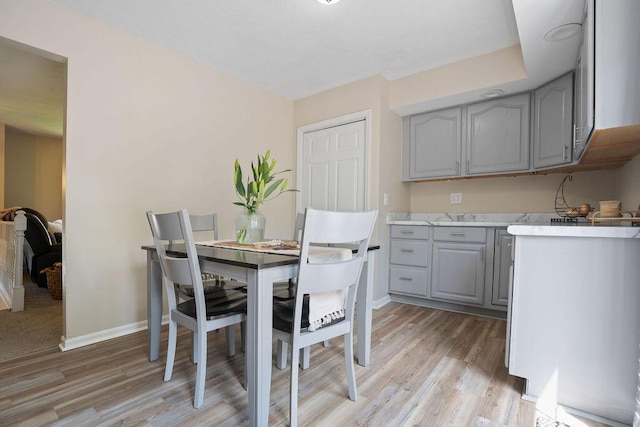 6161 Ridgewood Ct, Florence, KY 41042 - dining room with light wood-style floors and baseboards