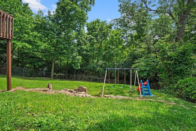 6161 Ridgewood Ct, Florence, KY 41042 - fenced backyard featuring a playground